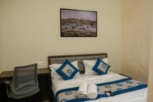 Postel nebo postele na pokoji v ubytování Hotel VRC