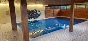 a large swimming pool in a building with at Ferienwohnung Brigitte in Füssen
