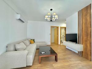 a living room with a couch and a tv at One bedroom Apartment 777 in Budva