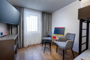 Μια τηλεόραση ή/και κέντρο ψυχαγωγίας στο Ferienwohnung TURNA Malbun