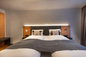 Ένα ή περισσότερα κρεβάτια σε δωμάτιο στο Ferienwohnung TURNA Malbun