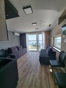 Posezení v ubytování OW Mewa domki apartamenty nad jeziorem