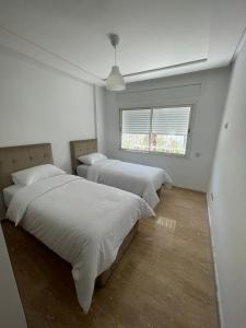 Complexe Bab Dikki客房内的一张或多张床位