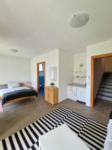 a bedroom with a bed and a staircase in it at Oasi Ulivi in San Siro