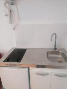 Η κουζίνα ή μικρή κουζίνα στο Rimk Location