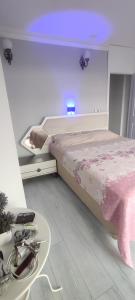 a bedroom with a bed and a table and a sink at Modern design house in the heart of Marmaris in Marmaris