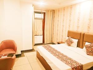 Postel nebo postele na pokoji v ubytování Hotel Tela Suite Near IGI Airport Delhi