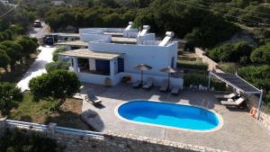 an aerial view of a house with a swimming pool at Mastiha Villas in Chios