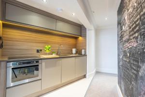 a kitchen with a chalkboard wall at Cocoa Loft in York