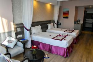Postel nebo postele na pokoji v ubytování Merica Hotel + 37 fotografií