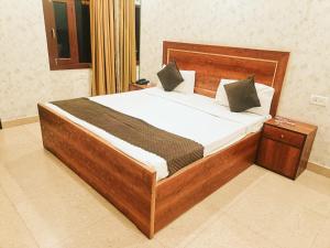Postel nebo postele na pokoji v ubytování Hotel Tela Suite Near IGI Airport Delhi
