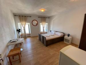 Postel nebo postele na pokoji v ubytování Studio apartman i sobe SIDRO