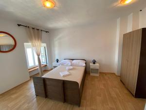 Postel nebo postele na pokoji v ubytování Studio apartman i sobe SIDRO