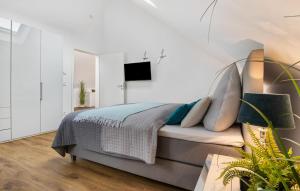 Ein Bett oder Betten in einem Zimmer der Unterkunft Hafenjuwel