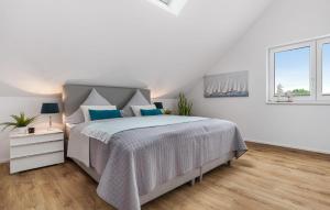 Ein Bett oder Betten in einem Zimmer der Unterkunft Hafenjuwel