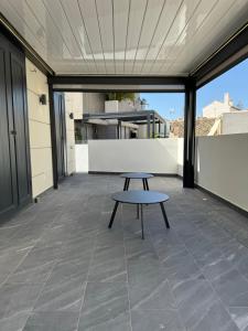 a bench sitting on the balcony of a building at Loft Huerto Old Town in Estepona