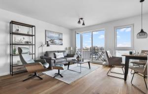 a living room with a couch and a table at Segler Nest in Olpenitz