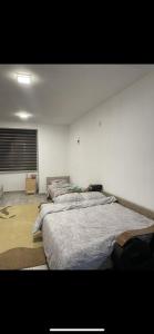 Postel nebo postele na pokoji v ubytování Apartman Ilhan
