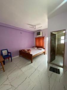 Gitanjali Hotel & Restaurant客房内的一张或多张床位