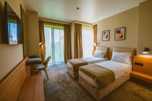 Postel nebo postele na pokoji v ubytování B1 Downtown Hotel