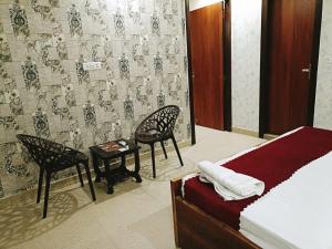 Postel nebo postele na pokoji v ubytování Hotel Tela Suite Near IGI Airport Delhi