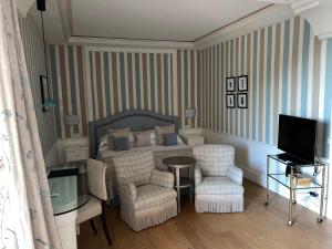 Телевизор и/или развлекательный центр в Cala del Porto Punta Ala - Preferred Hotels