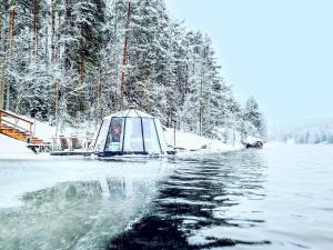 a tent on a lake in the snow at Yli-Kaitala Hut in Mankala +10 photos