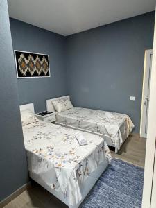 Rúm í herbergi á Bujtina e Qilimave