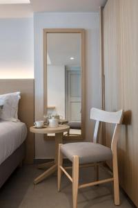 Postel nebo postele na pokoji v ubytování Aeifos Boutique Hotel