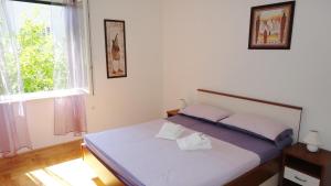 Postel nebo postele na pokoji v ubytování Luxurious Djuran Apartment