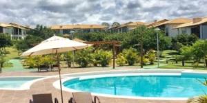 Bazén v ubytování Apto na Reserva Imbassaí nebo v jeho okolí