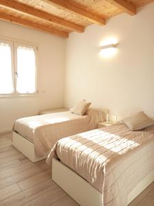 Ένα ή περισσότερα κρεβάτια σε δωμάτιο στο L'Oasi di Anna