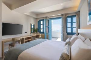 Postel nebo postele na pokoji v ubytování Aeifos Boutique Hotel