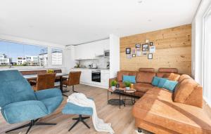 a living room with a couch and a table at Navia in Olpenitz