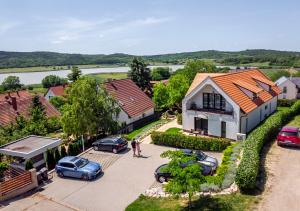 an aerial view of a house with cars parked in a driveway at Pilger Apartments in Tihany