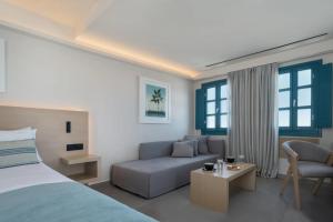 Postel nebo postele na pokoji v ubytování Aeifos Boutique Hotel