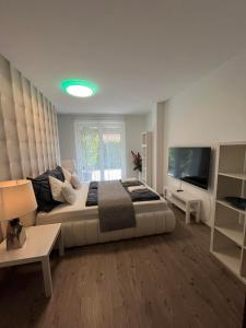 Katil atau katil-katil dalam bilik di Luxus Partivilla Apartman