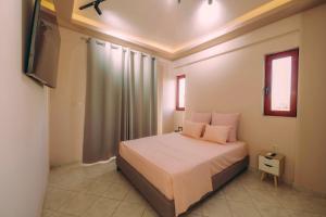 Postel nebo postele na pokoji v ubytování Ananda Apartments