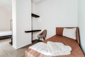 Postel nebo postele na pokoji v ubytování Como Lakeside Suites