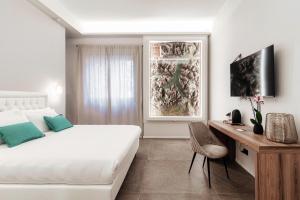 TV a/nebo společenská místnost v ubytování Como Lakeside Suites
