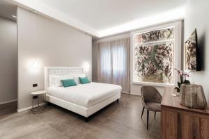 Postel nebo postele na pokoji v ubytování Como Lakeside Suites + 37 fotografií