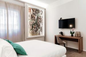 TV a/nebo společenská místnost v ubytování Como Lakeside Suites