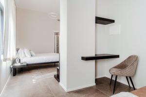 Postel nebo postele na pokoji v ubytování Como Lakeside Suites