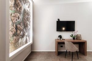 TV a/nebo společenská místnost v ubytování Como Lakeside Suites