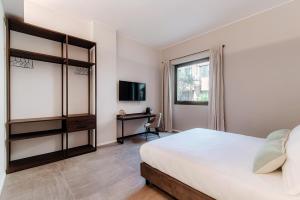 Postel nebo postele na pokoji v ubytování Como Lakeside Suites