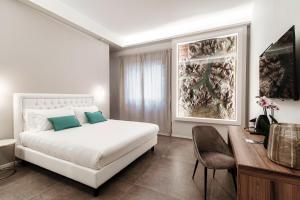 Postel nebo postele na pokoji v ubytování Como Lakeside Suites