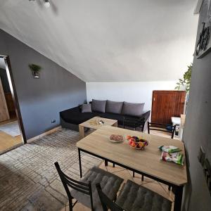a living room with a table and a couch at Luciana 2 in Zadar