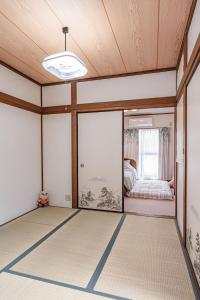 Postel nebo postele na pokoji v ubytování 易居の宿