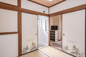 TV a/nebo společenská místnost v ubytování 易居の宿