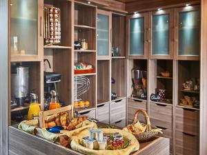 a kitchen with a buffet of food on a table at Logis hôtel Au Relais Nivernais in Nevers